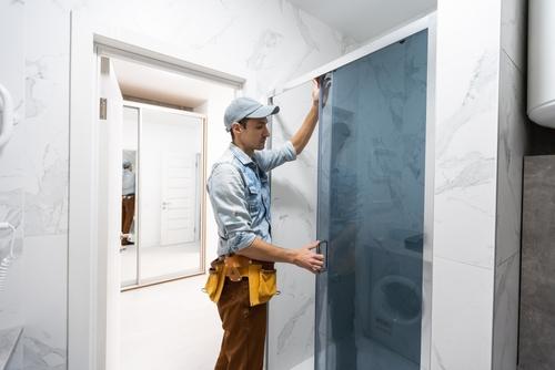 bathroom remodel contractor installing shower